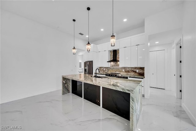 427 SW 21st Ter, Cape Coral, FL 33991 - kitchen with appliances with stainless steel finishes, modern cabinets, wall chimney exhaust hood, a sink, and white cabinets