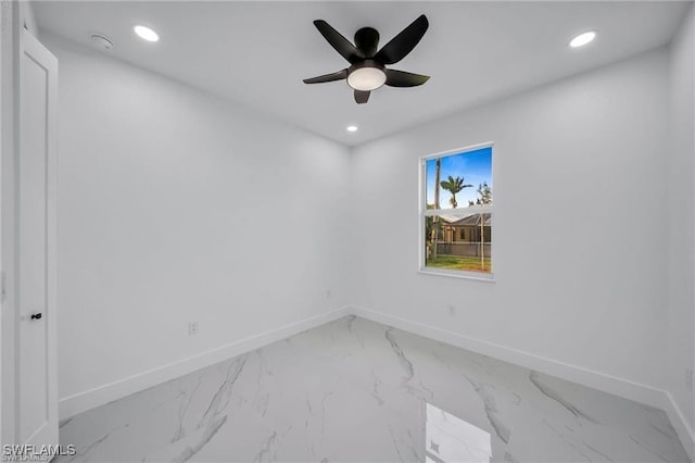 427 SW 21st Ter, Cape Coral, FL 33991 - unfurnished room with baseboards, recessed lighting, marble finish floors, and ceiling fan