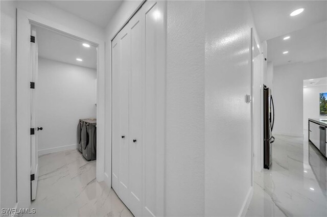 427 SW 21st Ter, Cape Coral, FL 33991 - corridor featuring washer and clothes dryer, light marble finish flooring, recessed lighting, and baseboards