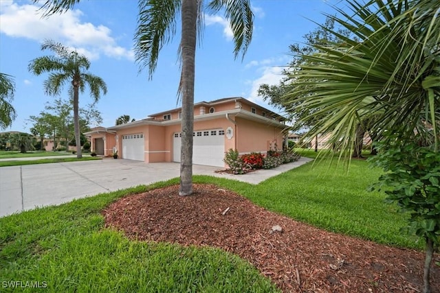 20025 Lake Vista Cir Unit 6B, Lehigh Acres, FL 33936 - view of front of house with stucco siding, driveway, an attached garage, and a front yard