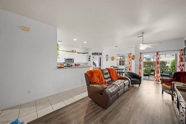 20025 Lake Vista Cir Unit 6B, Lehigh Acres, FL 33936 - living area featuring wood finished floors, ceiling fan, recessed lighting, and baseboards