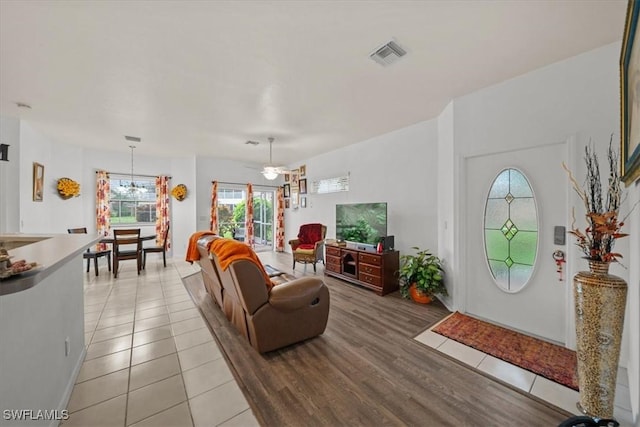 20025 Lake Vista Cir Unit 6B, Lehigh Acres, FL 33936 - living area featuring light tile patterned flooring and ceiling fan