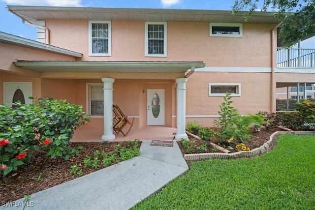 20025 Lake Vista Cir Unit 6B, Lehigh Acres, FL 33936 - view of front facade featuring a porch and stucco siding