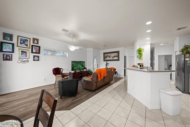20025 Lake Vista Cir Unit 6B, Lehigh Acres, FL 33936 - living area featuring a ceiling fan, light wood-type flooring, recessed lighting, and baseboards