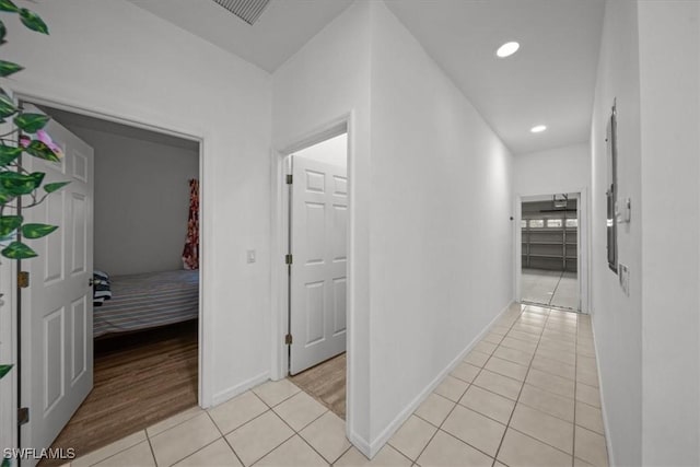 20025 Lake Vista Cir Unit 6B, Lehigh Acres, FL 33936 - hall with light tile patterned floors, recessed lighting, and baseboards