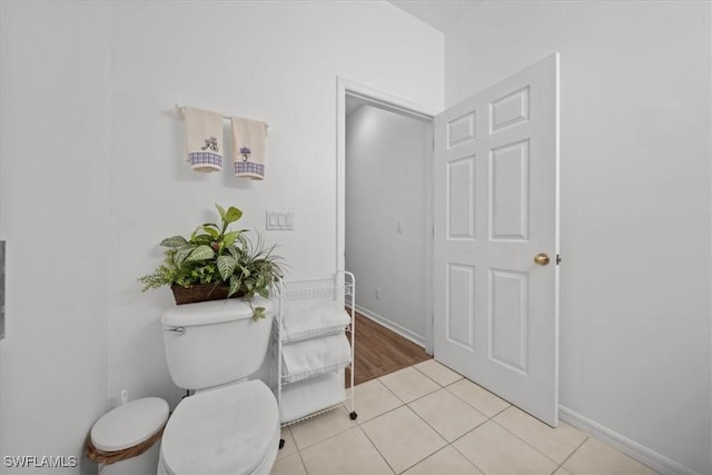 20025 Lake Vista Cir Unit 6B, Lehigh Acres, FL 33936 - bathroom with toilet, tile patterned flooring, and baseboards