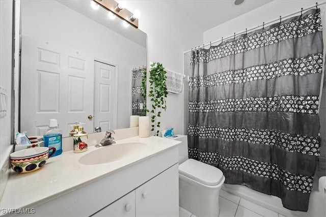 20025 Lake Vista Cir Unit 6B, Lehigh Acres, FL 33936 - full bathroom with vanity, toilet, and tile patterned flooring