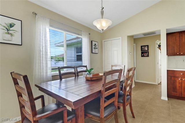 2223 SW 16th Ter, Cape Coral, FL 33991 - dining space with light tile patterned floors, baseboards, and lofted ceiling