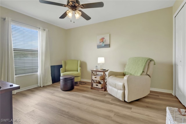 2223 SW 16th Ter, Cape Coral, FL 33991 - sitting room featuring baseboards, light wood-type flooring, and a ceiling fan