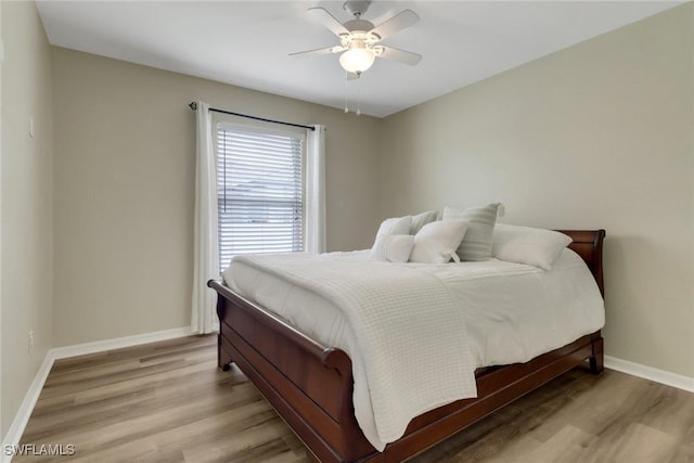 2223 SW 16th Ter, Cape Coral, FL 33991 - bedroom featuring wood finished floors, baseboards, and ceiling fan