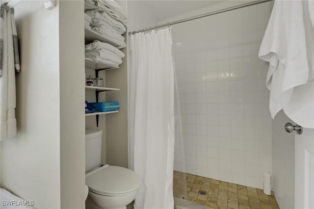 2223 SW 16th Ter, Cape Coral, FL 33991 - bathroom featuring toilet and a shower stall