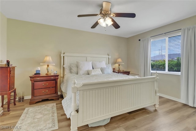 2223 SW 16th Ter, Cape Coral, FL 33991 - bedroom featuring light wood-style floors, baseboards, and ceiling fan