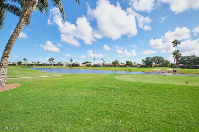 9110 Bayberry Bnd Unit 102, Fort Myers, FL 33908 - view of home's community featuring a water view, a lawn, and golf course view