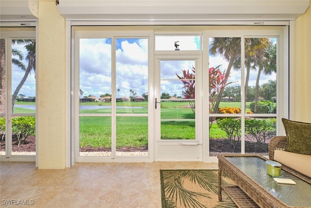 9110 Bayberry Bnd Unit 102, Fort Myers, FL 33908 - doorway with plenty of natural light, view of golf course, and tile patterned flooring