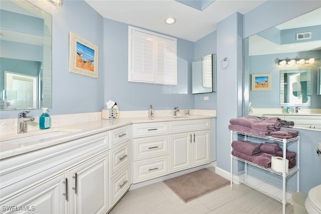 9110 Bayberry Bnd Unit 102, Fort Myers, FL 33908 - bathroom featuring double vanity, recessed lighting, and baseboards