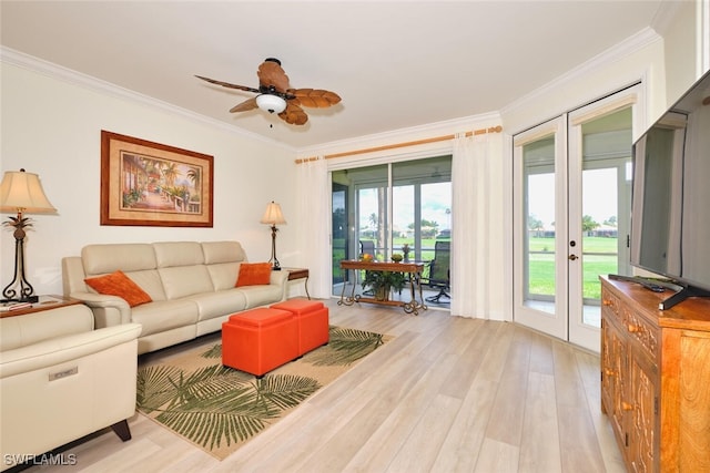 9110 Bayberry Bnd Unit 102, Fort Myers, FL 33908 - living area with ornamental molding, light wood-style floors, ceiling fan, and french doors