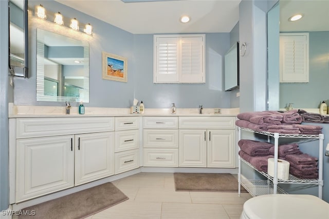 9110 Bayberry Bnd Unit 102, Fort Myers, FL 33908 - bathroom featuring double vanity, recessed lighting, and tile patterned floors