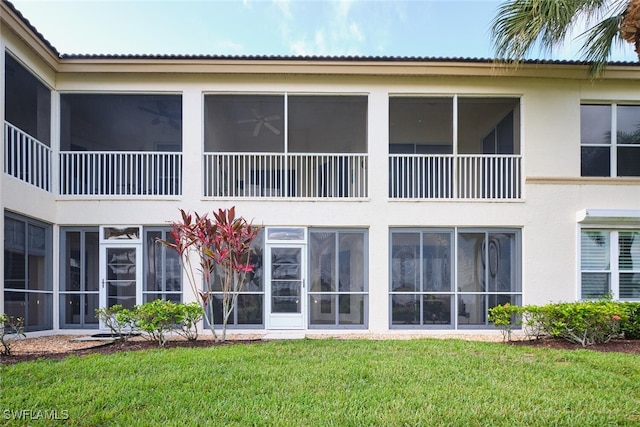 9110 Bayberry Bnd Unit 102, Fort Myers, FL 33908 - back of house featuring stucco siding and a yard
