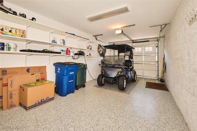 9110 Bayberry Bnd Unit 102, Fort Myers, FL 33908 - garage with a textured wall and a garage door opener