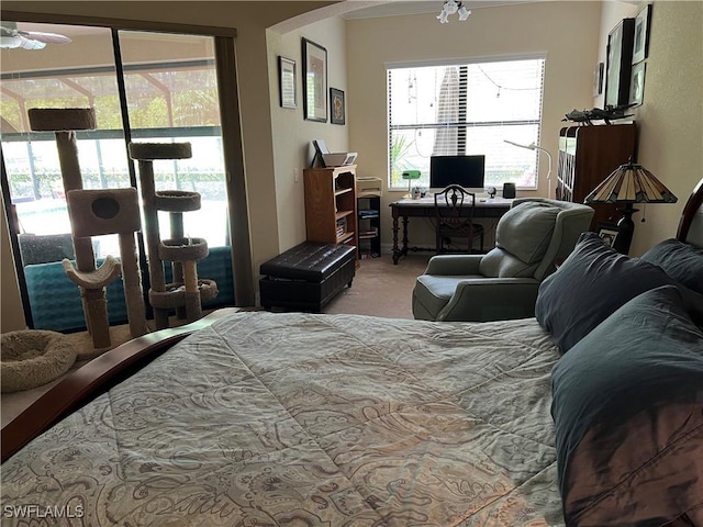 11010 Longwing Dr, Fort Myers, FL 33912 - carpeted bedroom with access to exterior, a desk, and arched walkways