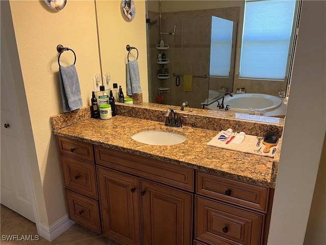 11010 Longwing Dr, Fort Myers, FL 33912 - bathroom with vanity, a tile shower, a garden tub, and tile patterned flooring