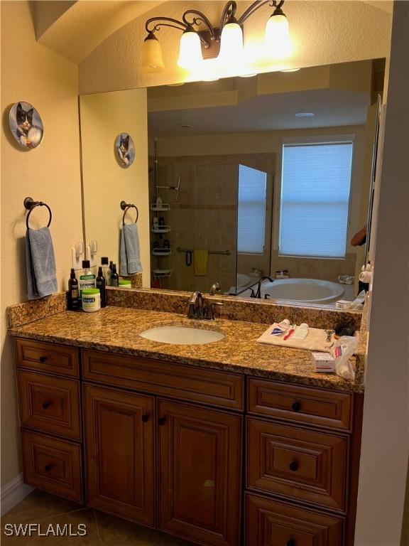 11010 Longwing Dr, Fort Myers, FL 33912 - bathroom featuring vanity, a shower stall, and a bath