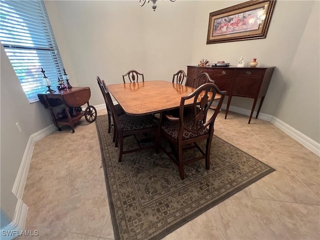 11010 Longwing Dr, Fort Myers, FL 33912 - dining space featuring baseboards, a chandelier, and light tile patterned floors