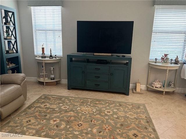 11010 Longwing Dr, Fort Myers, FL 33912 - living room with light tile patterned floors and baseboards