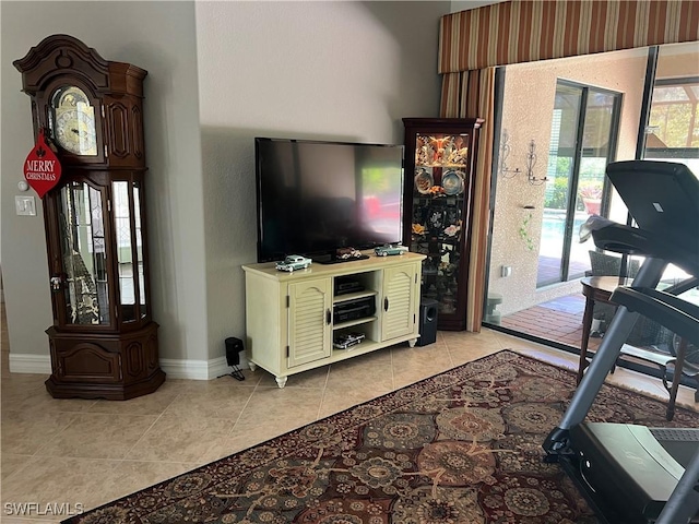 11010 Longwing Dr, Fort Myers, FL 33912 - exercise area featuring light tile patterned floors and baseboards
