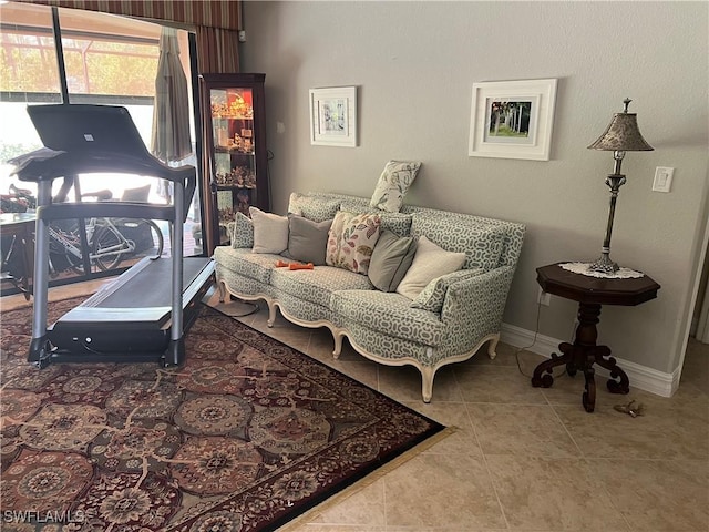 11010 Longwing Dr, Fort Myers, FL 33912 - living area featuring baseboards and tile patterned flooring