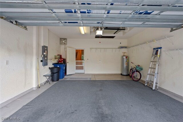 garage featuring electric panel, water heater, a garage door opener, and a textured wall