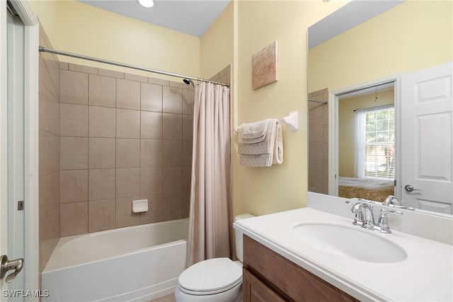 ensuite bathroom featuring shower / tub combo and vanity