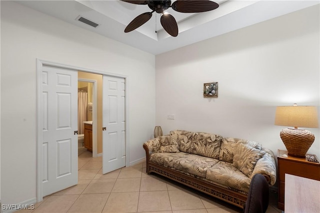 living room featuring ceiling fan and light tile patterned floors