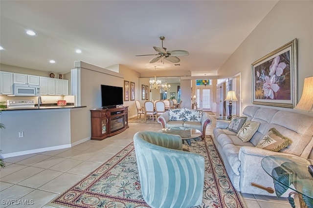 9211 Independence Way, Fort Myers, FL 33913 - living area featuring light tile patterned floors, a chandelier, a ceiling fan, and recessed lighting