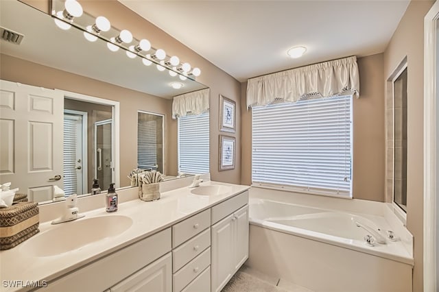 9211 Independence Way, Fort Myers, FL 33913 - bathroom with a bath, double vanity, a shower stall, and tile patterned floors