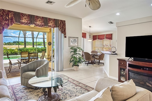 9211 Independence Way, Fort Myers, FL 33913 - living area featuring light tile patterned floors, plenty of natural light, ceiling fan, and recessed lighting