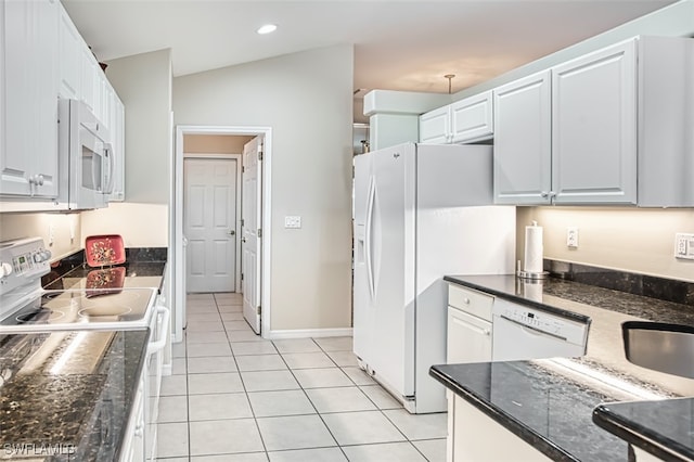 9211 Independence Way, Fort Myers, FL 33913 - kitchen featuring white appliances, light tile patterned floors, white cabinets, recessed lighting, and dark stone countertops