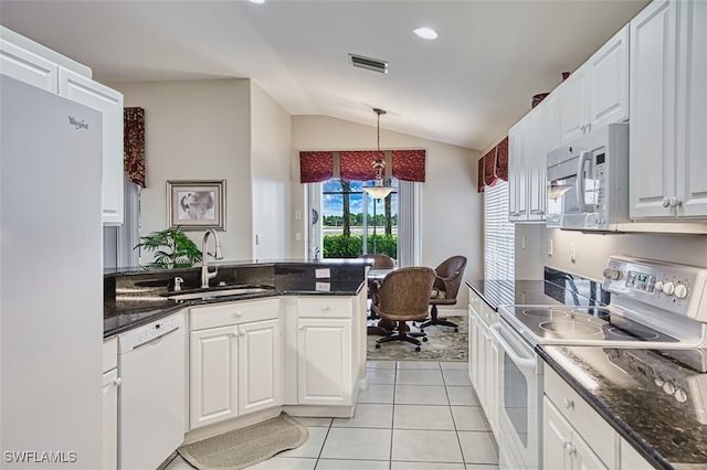 9211 Independence Way, Fort Myers, FL 33913 - kitchen with white appliances, lofted ceiling, white cabinetry, light tile patterned flooring, and pendant lighting