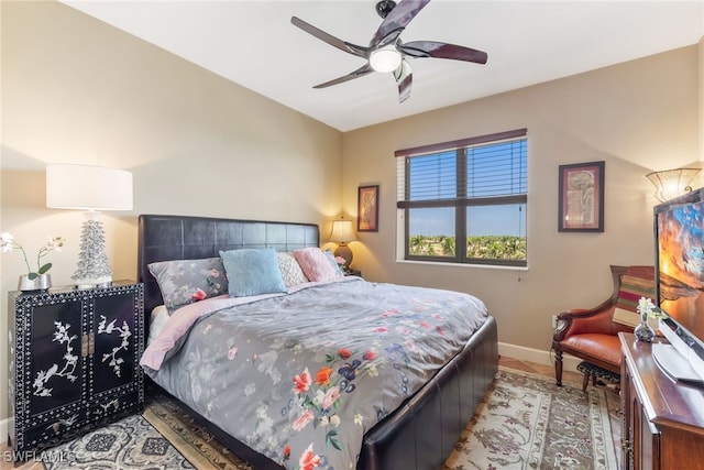 11600 Court Of Palms Unit 301, Fort Myers, FL 33908 - bedroom featuring baseboards and a ceiling fan