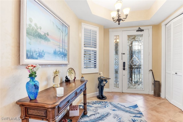 11600 Court Of Palms Unit 301, Fort Myers, FL 33908 - foyer entrance with a chandelier and tile patterned flooring