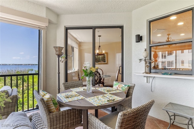 11600 Court Of Palms Unit 301, Fort Myers, FL 33908 - sunroom featuring plenty of natural light and a water view