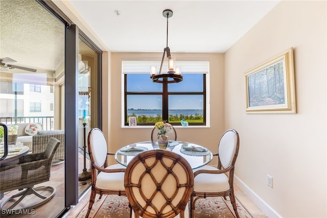 11600 Court Of Palms Unit 301, Fort Myers, FL 33908 - dining room featuring a chandelier and baseboards
