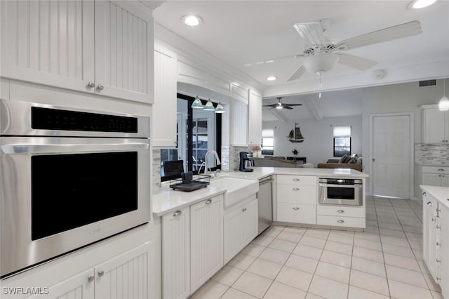 1528 SW 52nd Ln, Cape Coral, FL 33914 - kitchen with stainless steel appliances, decorative backsplash, light tile patterned floors, open floor plan, and recessed lighting