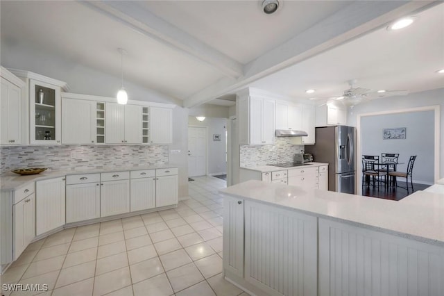 1528 SW 52nd Ln, Cape Coral, FL 33914 - kitchen with stainless steel fridge, backsplash, a ceiling fan, light countertops, and white cabinets