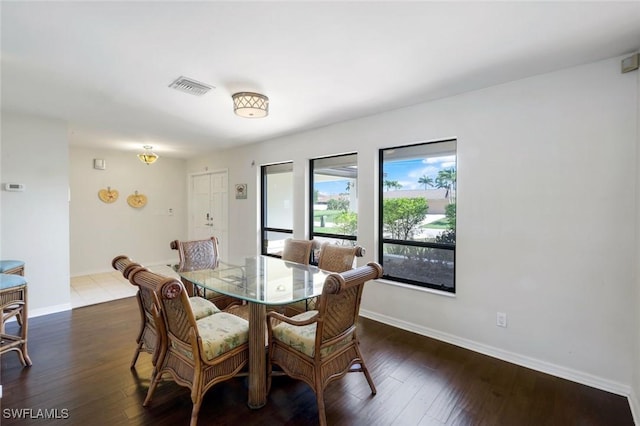 1528 SW 52nd Ln, Cape Coral, FL 33914 - dining space featuring baseboards and dark wood-style flooring