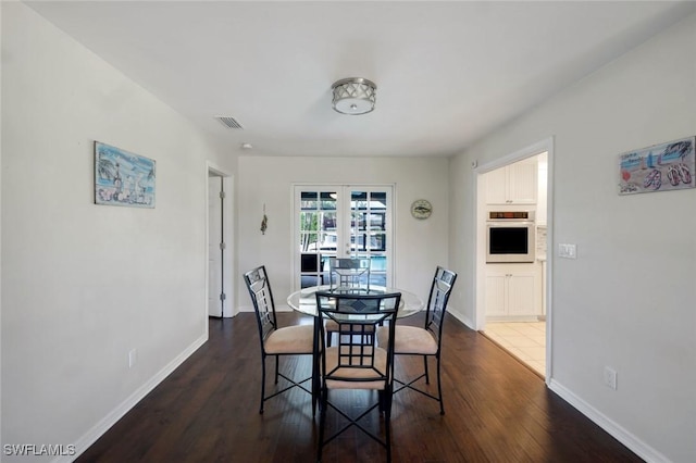 1528 SW 52nd Ln, Cape Coral, FL 33914 - dining space with dark wood-style floors and baseboards