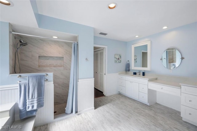 1528 SW 52nd Ln, Cape Coral, FL 33914 - full bath with tiled shower, vanity, recessed lighting, wood finished floors, and a wainscoted wall