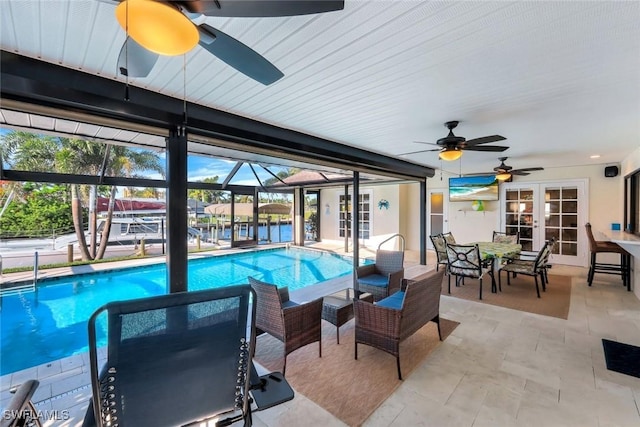 1528 SW 52nd Ln, Cape Coral, FL 33914 - swimming pool with french doors, ceiling fan, and a patio area