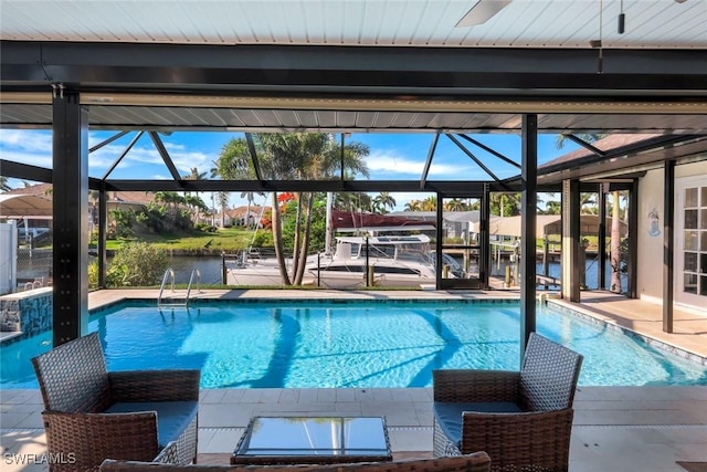 1528 SW 52nd Ln, Cape Coral, FL 33914 - outdoor pool with boat lift, a boat dock, a water view, and glass enclosure