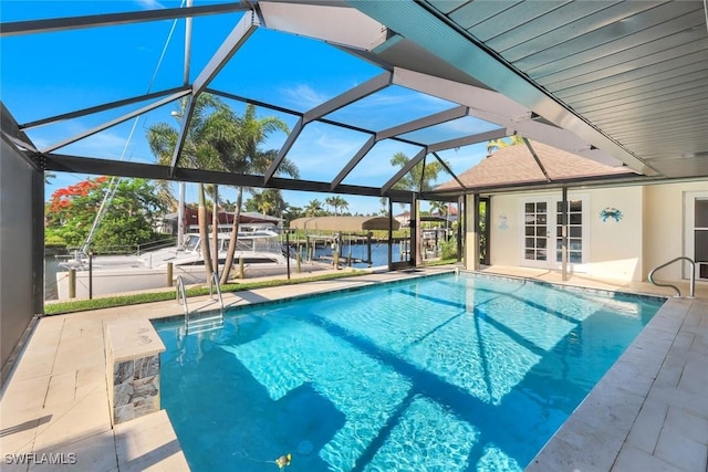 1528 SW 52nd Ln, Cape Coral, FL 33914 - outdoor pool featuring french doors, a patio area, a dock, and boat lift